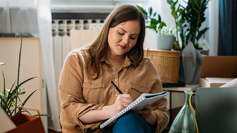 Woman writing peacefully in journal