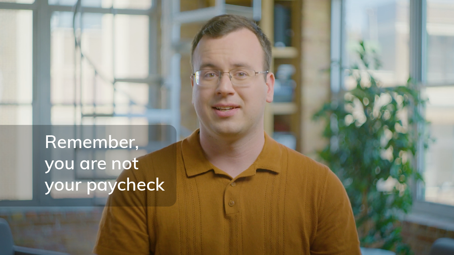 Screengrab of Nathan Astle from video with the words "Remember, you are not your paycheck" overlayed