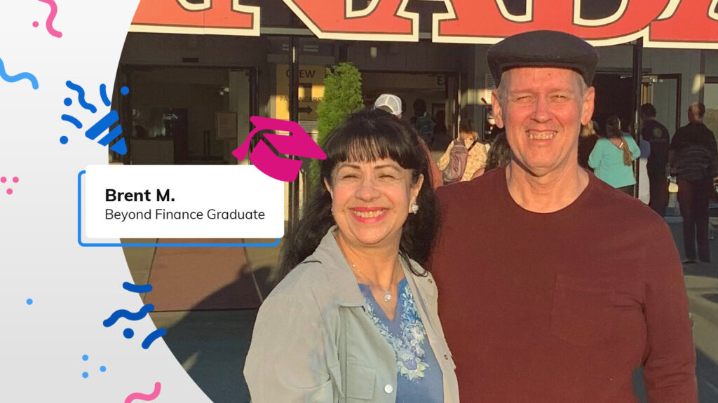 Beyond Finance Graduate Brent M. pictured here smiling with his wife