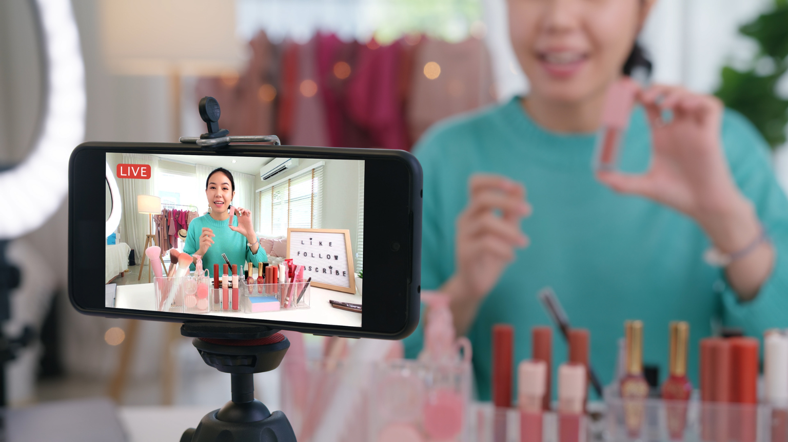 A woman sells makeup on a live stream.