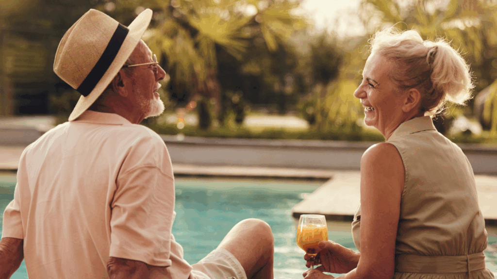 Older couple chatting poolside